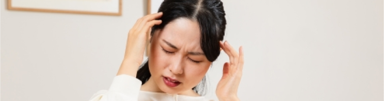 体調の悪い女性